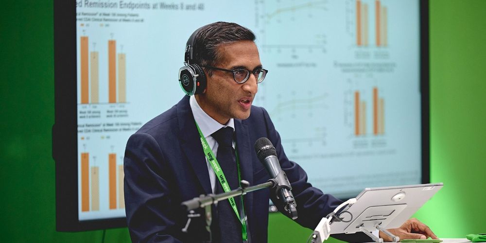a man wearing headphones and a suit and tie