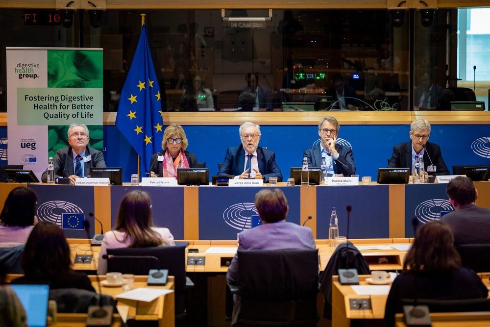 a group of people sitting at a table