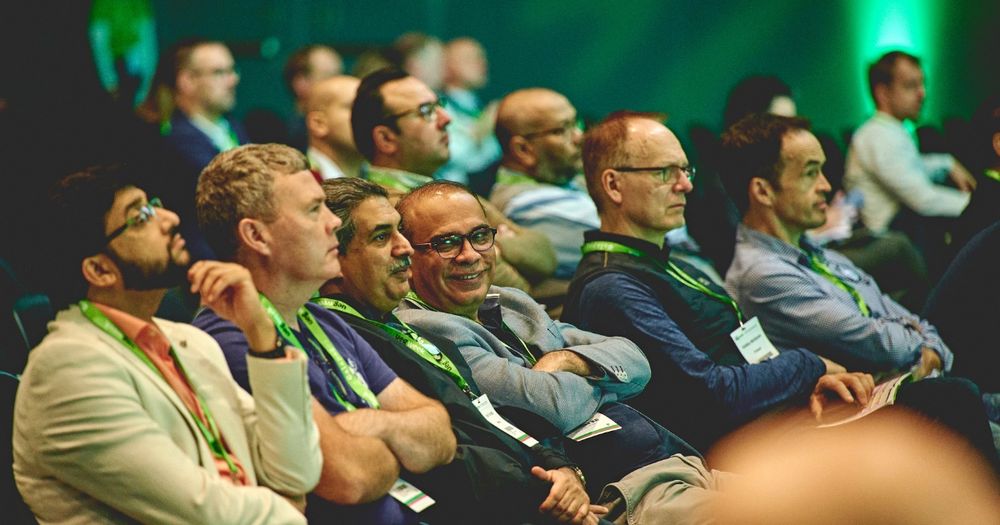 a group of people sitting in a row