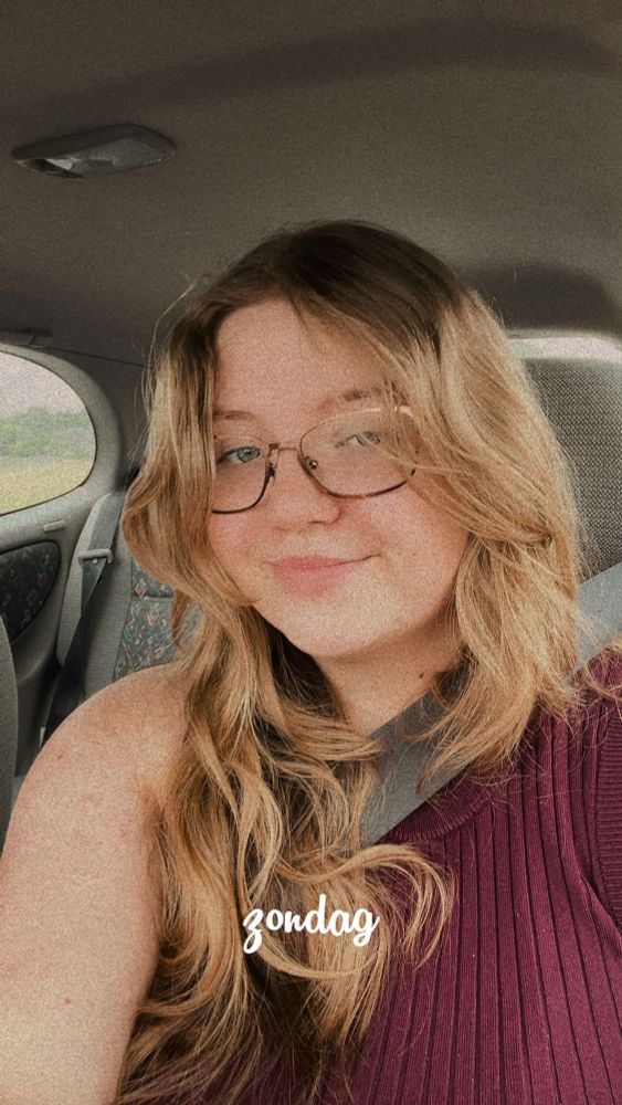 A selfie of me but in the car with my glasses on