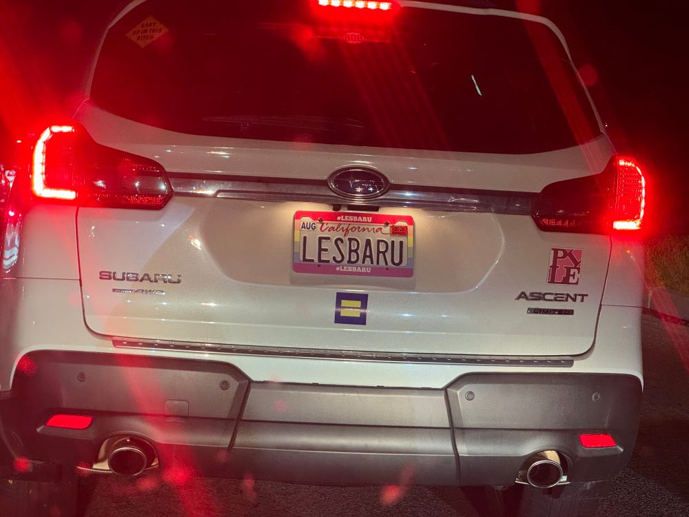 subaru ascent with the license plate "LESBARU"