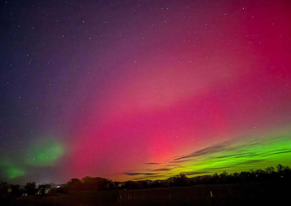 Vibrant aurora borealis over the Colorado night sky, shimmering in waves of purple, green, blue, and gold — the heavens alive with color and light, capturing a moment of pure cosmic wonder and collective awe.

night sky, aurora borealis, northern lights, Colorado, colorful sky, sky lovers, sky brilliance, sky magic, sky marvels, sky mania, universe, stars, wonder, awe, nature, energy, photography, night photography, celestial, cosmic, inspiration, beauty, healing, reflection, starlight, universe, stars, light show, atmosphere, photo by Eric Meleney