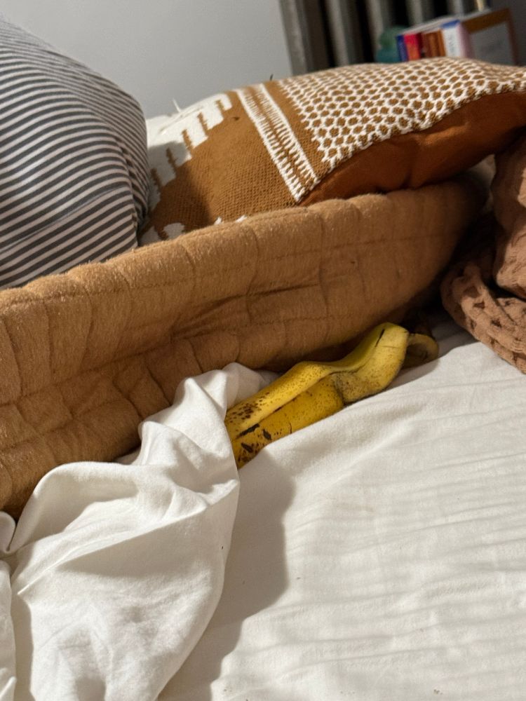 Half a banana in a bed 