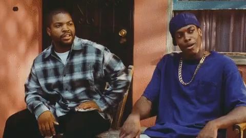 ice cube and snoop dogg sitting on a porch