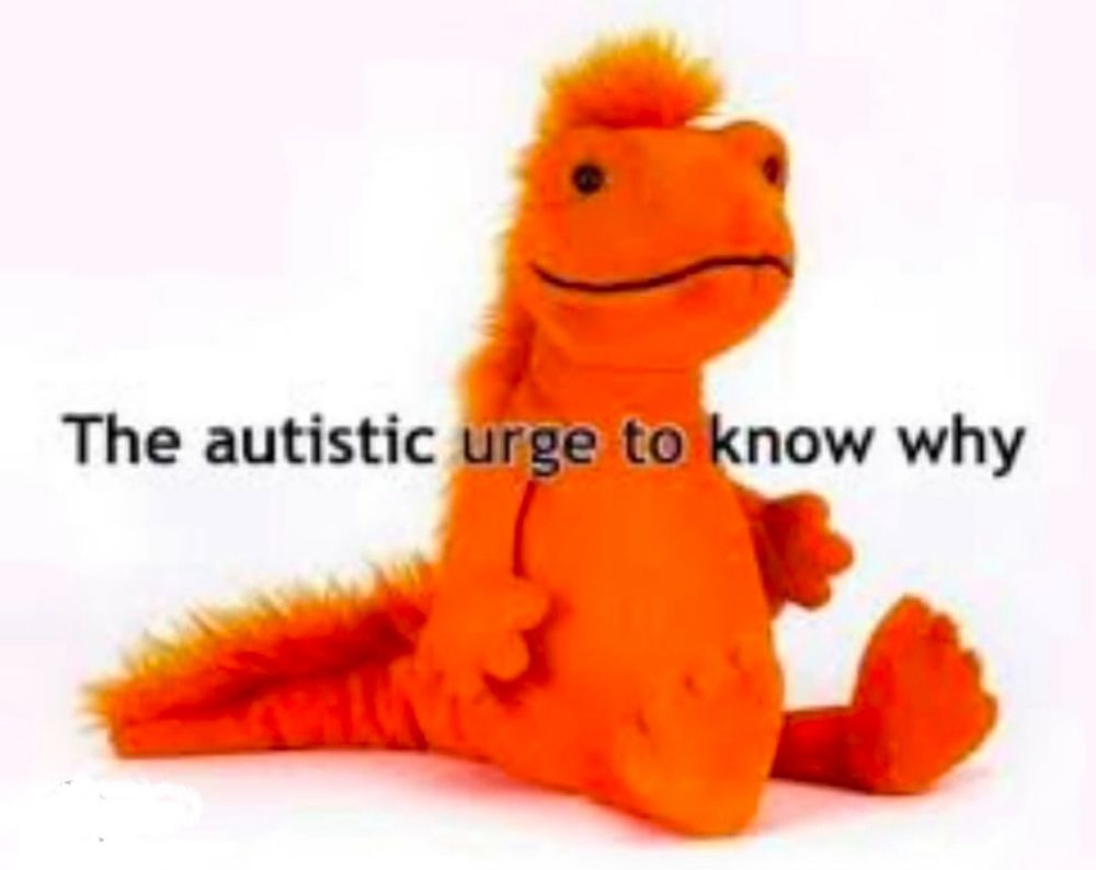 Orange dinosaur plushie sitting. Text reads The autistic urge to know why.