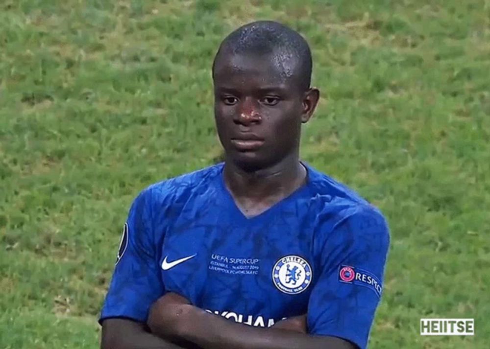 a man wearing a blue shirt that says uefa super cup on it