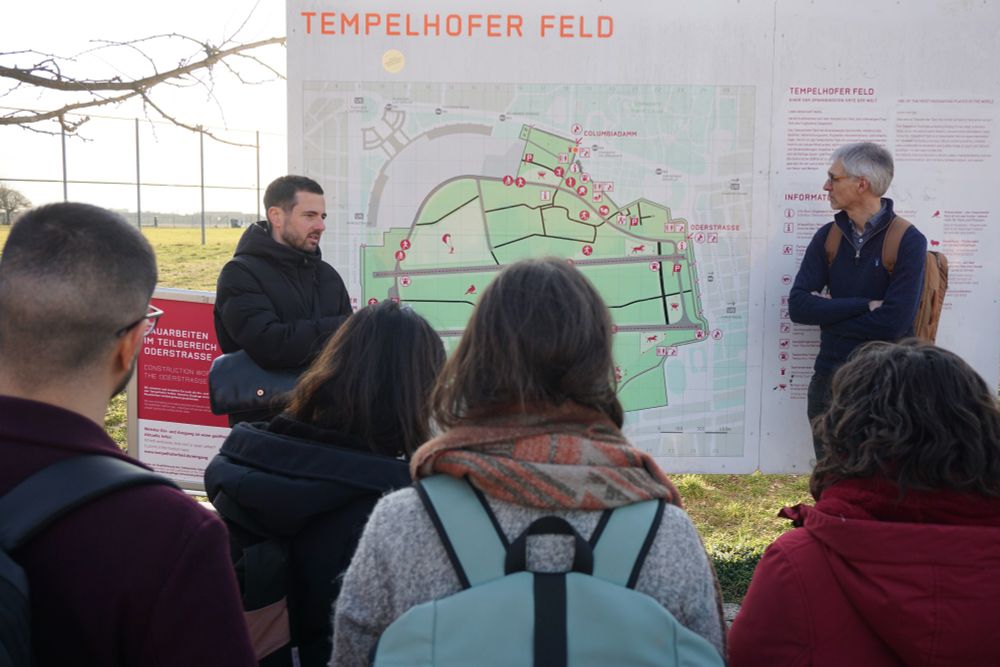 A person speaking to a group in a park in Berlin