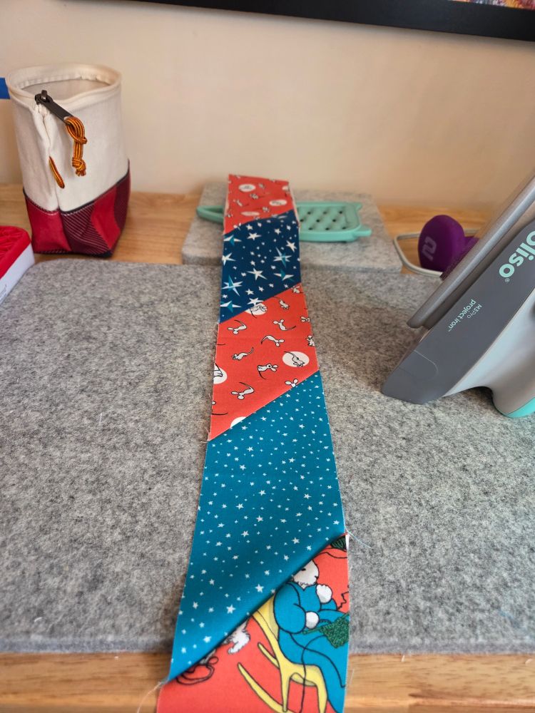 Scraps of Goodnight Moon fabric put together to make a scrapy binding. 