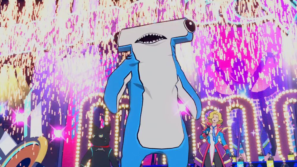 Chai wearing a hammerhead shark costume with fireworks behind him.