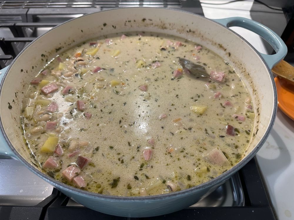 A picture of black-eyed pea chowder in a blue pot