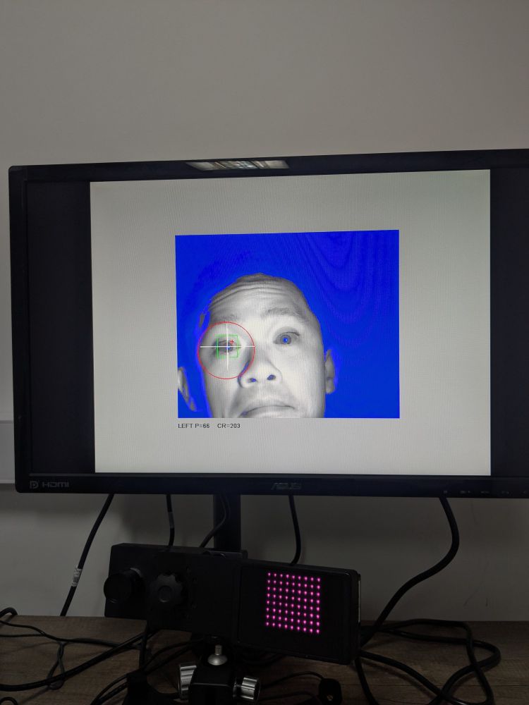 Image of a face displayed on the screen picked up in full infrared wonder by the eye tracking camera 