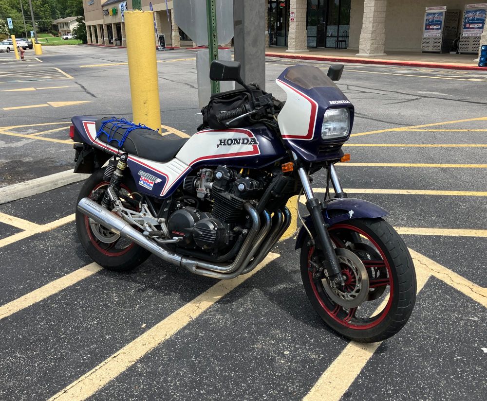 Honda CB1100F motorcycle parked in front of a strip mall.