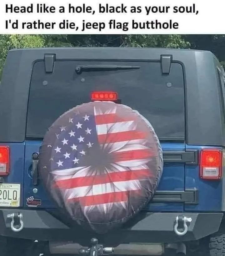 "Head like a Hole, black as your soul, I'd rather die, Jeep flag butthole"

Over a tire cover on a Jeep that is meant to be a sunflower but looks like a butthole.
