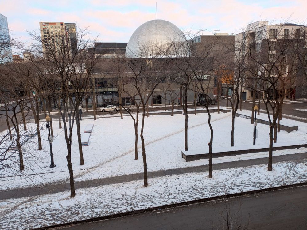Picture of a park in Montreal, in the winter, with an improvised diagonal path (where people cut across instead of following the predetermined path).