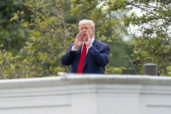 A fat orange imbecile talking bollocks on a roof. 