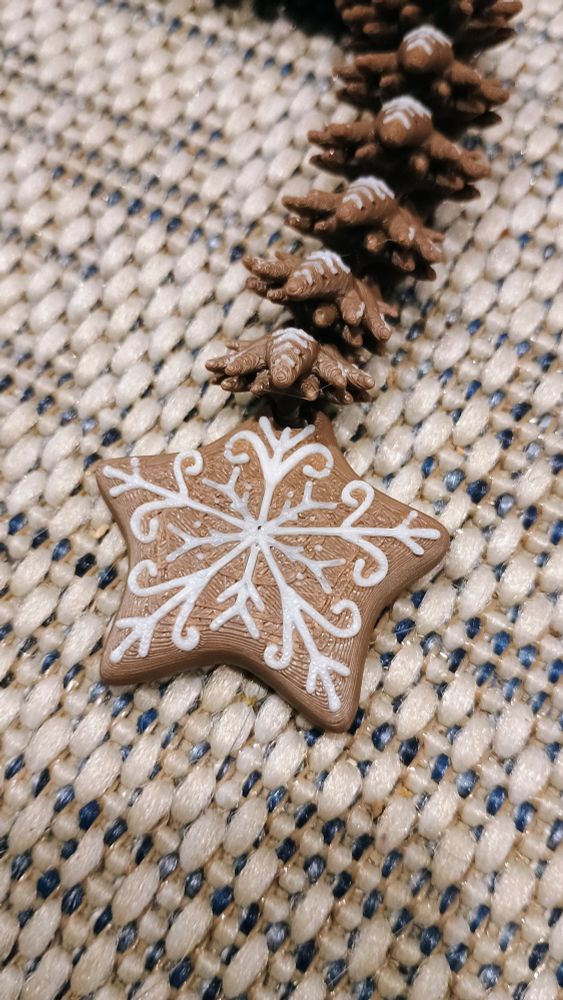 The tail of a 3d printed gingerbread dragon done on Bambu a1-mini.