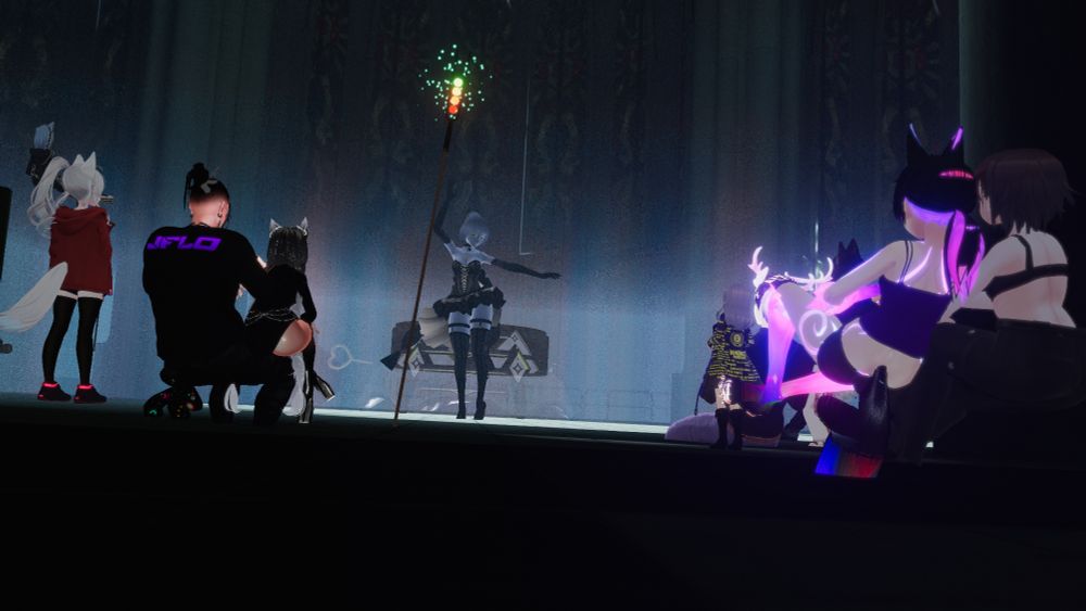 Venixia - a clockwork/doll looking girl - dancing in a dress amongst multicolored fog with a crowd watching.
Another incredible performance at the Cathedral of Witches!