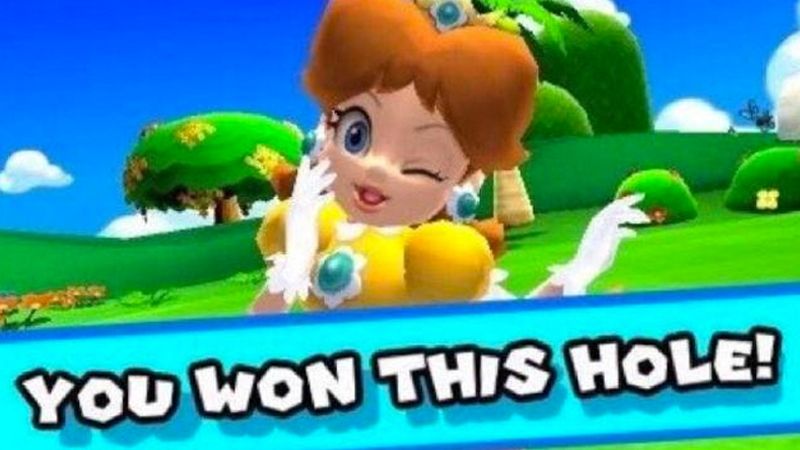 Princess daisy in mario golf striking a cute pose. A banner underneath reads "you won this hole!"