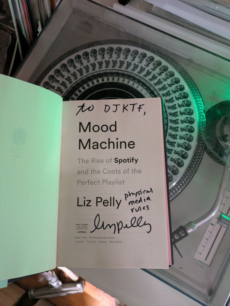 Title page of "Mood Machine: The Rise of Spotfiy and the Costs of the Perfect Playlist" signed by author Liz Pelly!! 