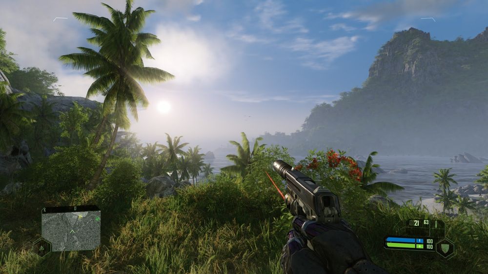 Tropical sunrise view in Crysis Remastered, player holding a pistol overlooking the coast.