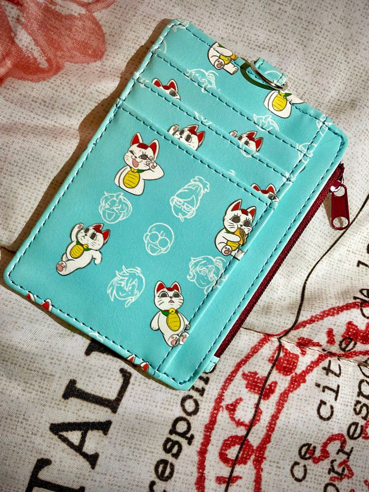 Pu card wallet teal and red. ID wallet with 4 card slots. Granny cat that can run printed on the back.