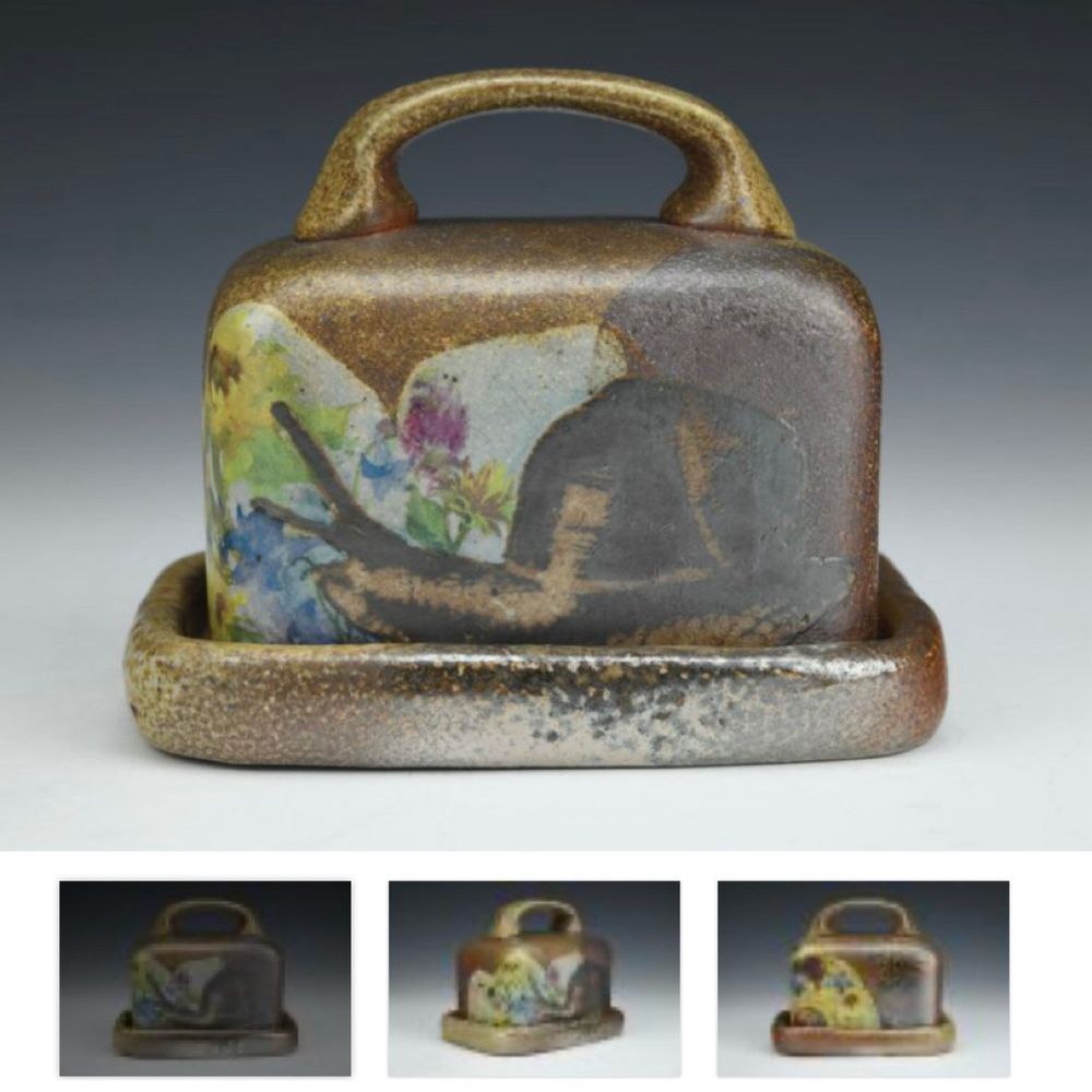A Rose Hardesty butter dish, woodfired, with a snail and flowers on the front. It is from the Charlie Cummings gallery website. Linked above. 