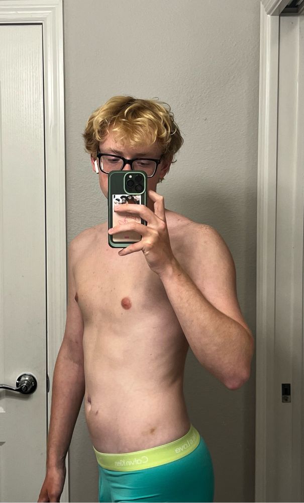 twinky blonde taking a mirror self in the bathroom showing off his pride calvin’s