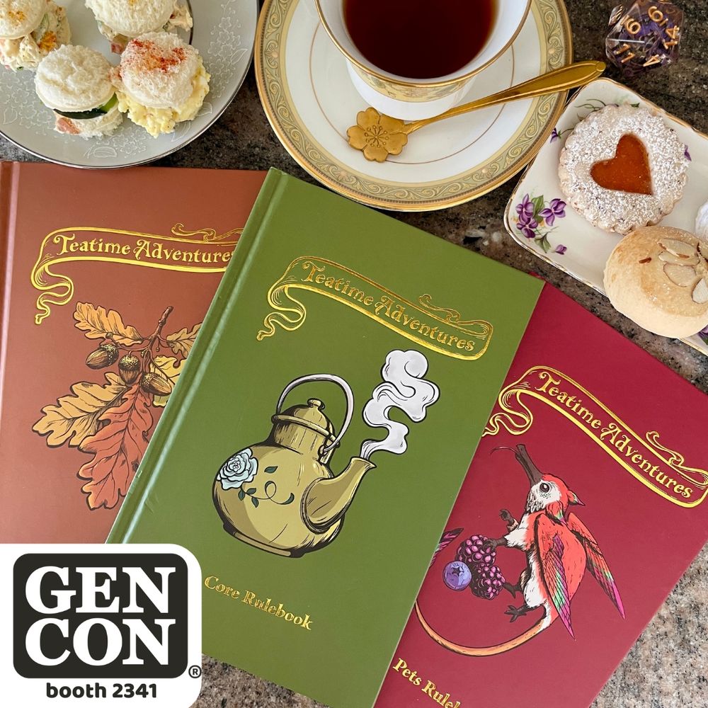 The three Teatime Adventures books lay on a table alongside a full tea service. 