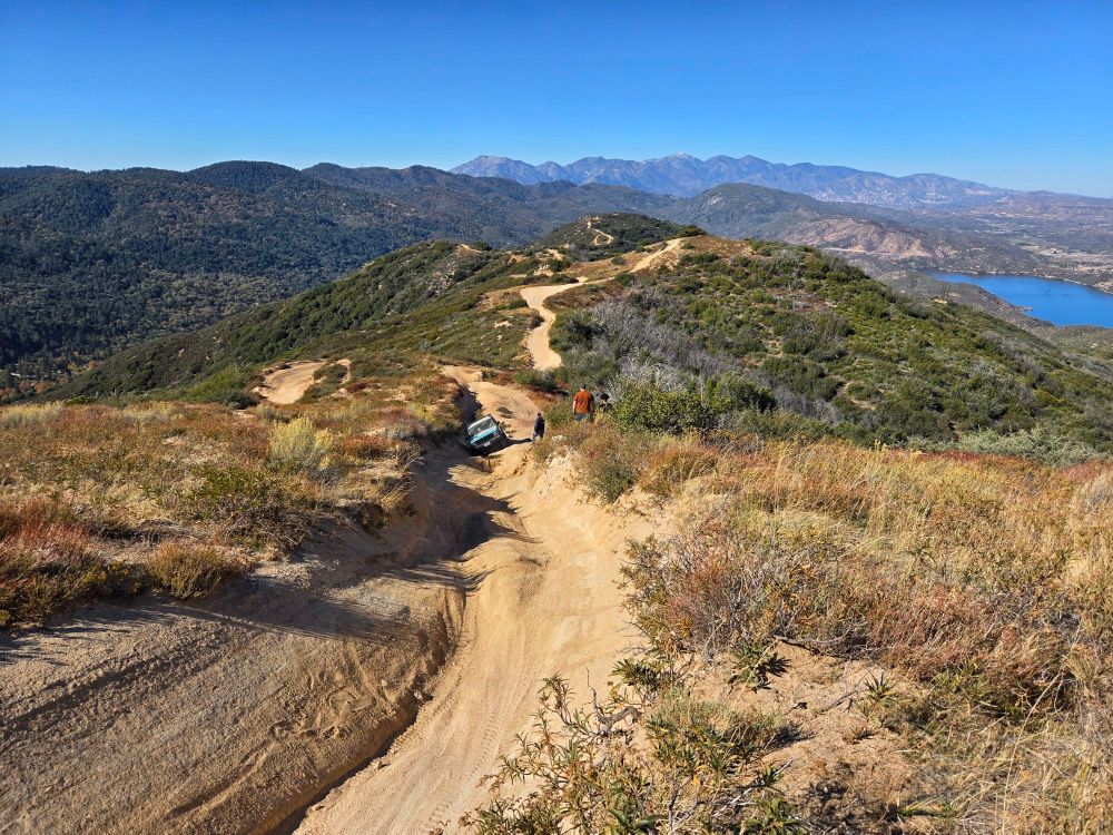The Jeep is stuck on the trail and tilted severely to one side. My buddies are brainstorming a solution