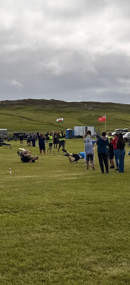 Falling over finishing line in race.