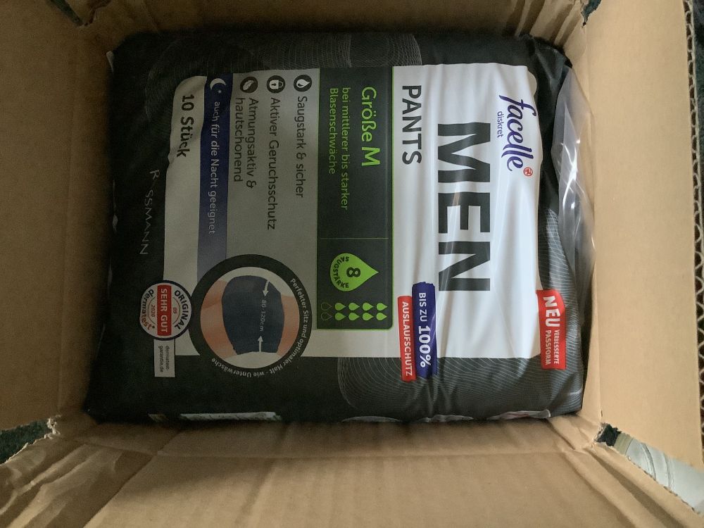 A box with a pack of pull ups for adults for men in it (size M).