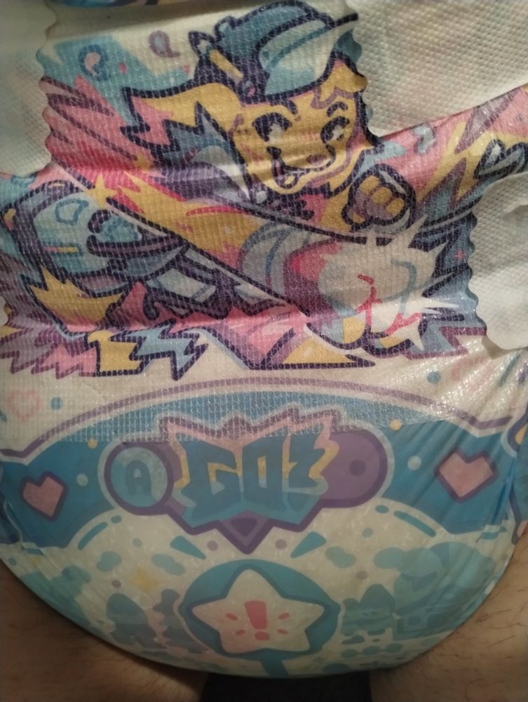 The front of a Pixel Pals diaper with Harlow on the front showing how round and full it got during the course of a day. 