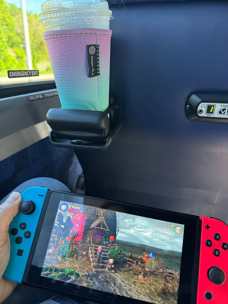 Picture shows iced coffee and a Switch game system