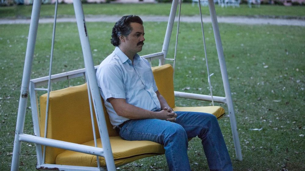 Pablo Escobar sitting on swing meme