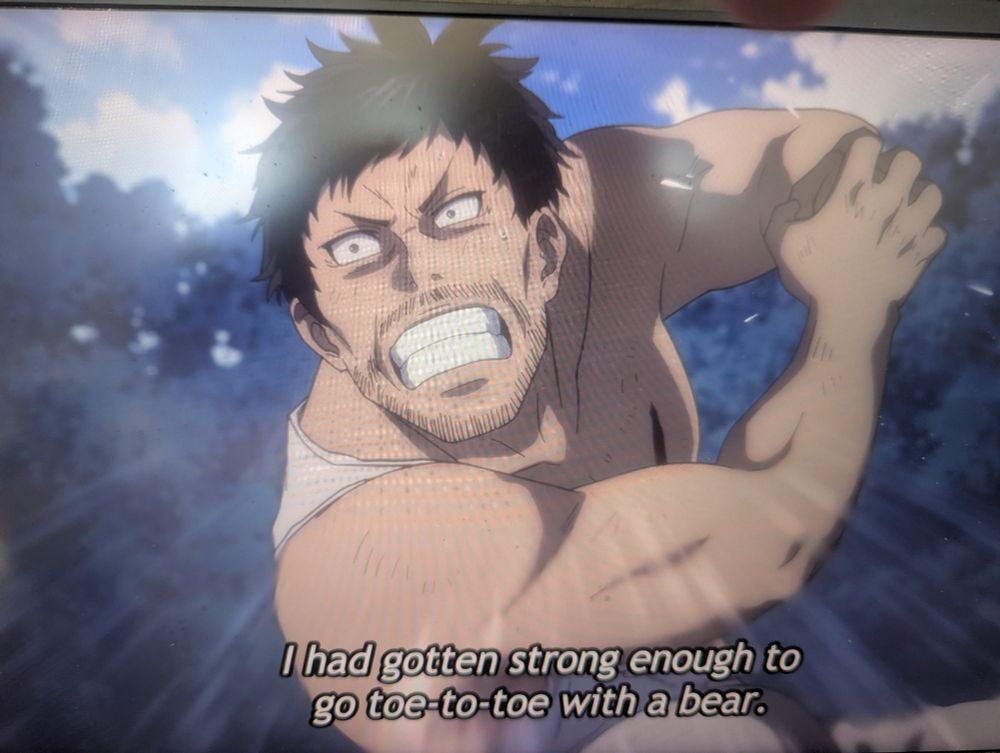 Tojima as a scruffy adult in a ripped white tank top saying:

I had gotten strong enough to go toe-to-toe with a bear