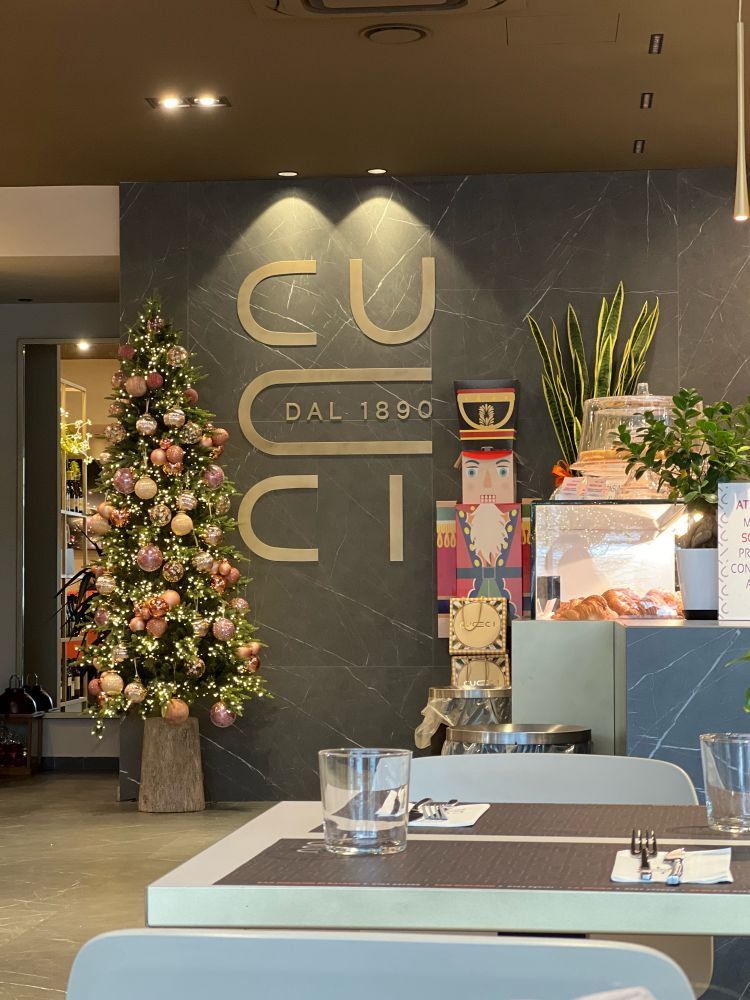 A view of the interior of a dinner with the name Cucci and the date “dal 1890”