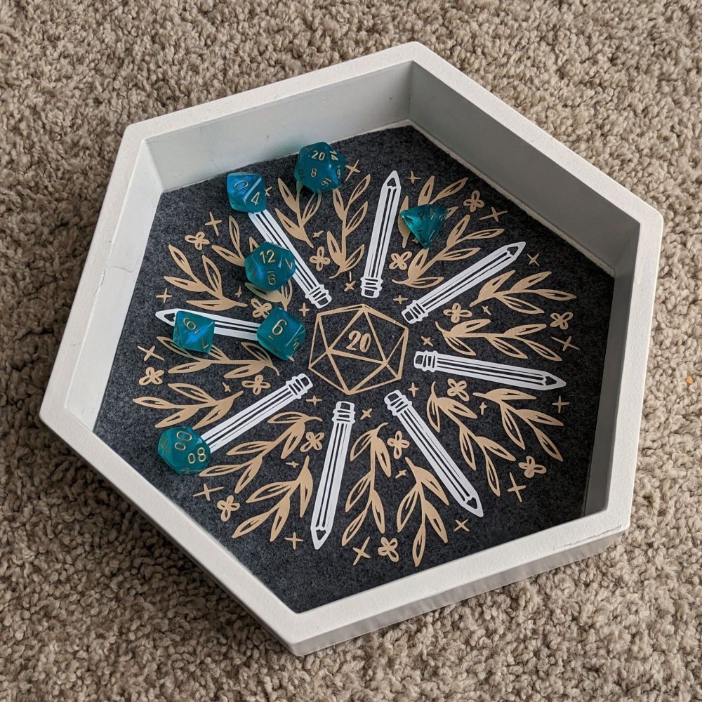 Dice tray with pencils and floral art 
