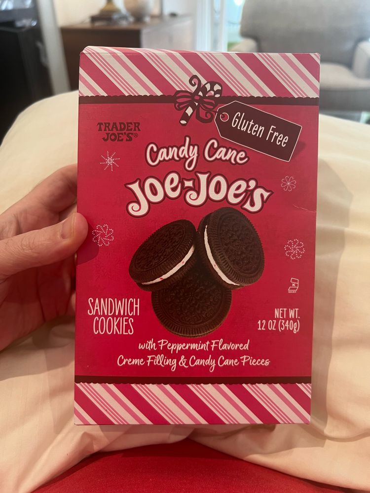 Holding a box of Trader Joe’s addictive Candy Cane Joe-Joe’s cookies