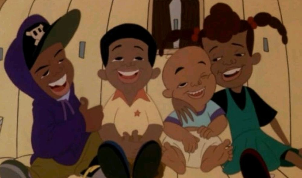 Cartoon movie of four Black kids laughing and hugging each other.