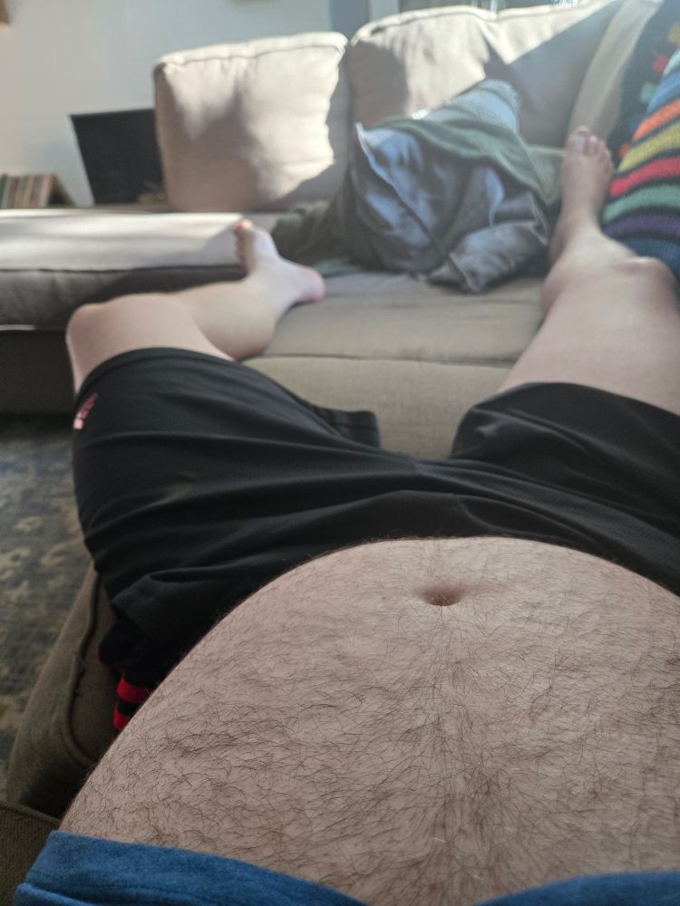 Furry belly and legs on a couch