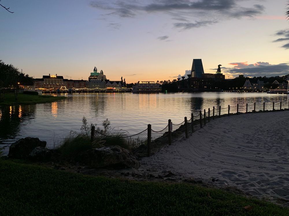 The sun sets behind the Boardwalk and Swan/Dolphin at Disney World. 