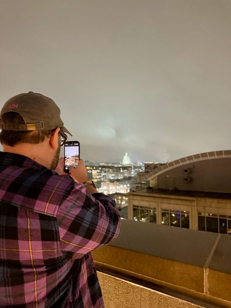 Me on the roof of the Arlo hotel taking a pic of the Capitol. 