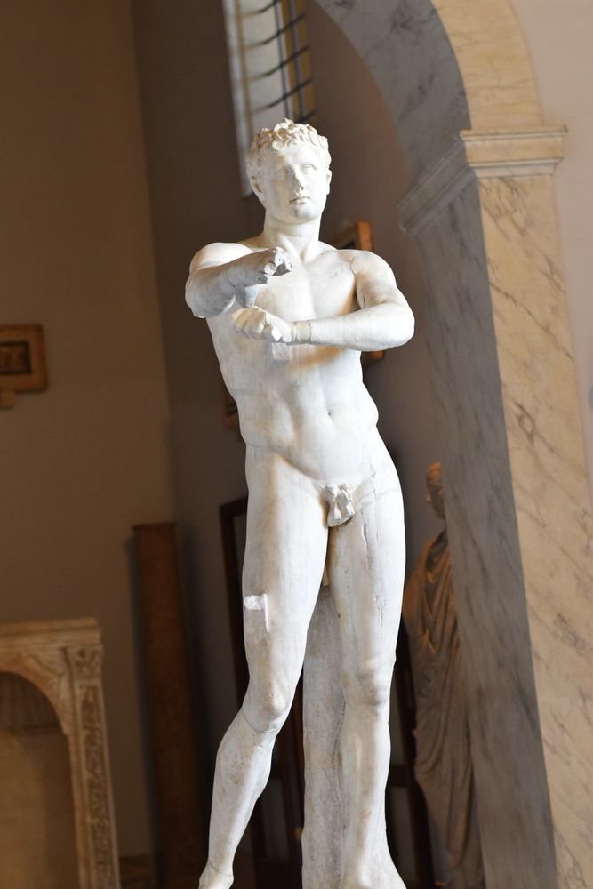 photo of a nude roman statue pointing at the camera with broken fingers. also its dick broke off. i didnt take this pic in the baths it was probably the vatican museum but oh well 