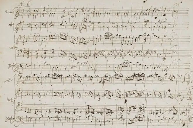 sheet music handwritten by Mozart; the notation is substantial and crowded in a legible but frantic-looking scrawl