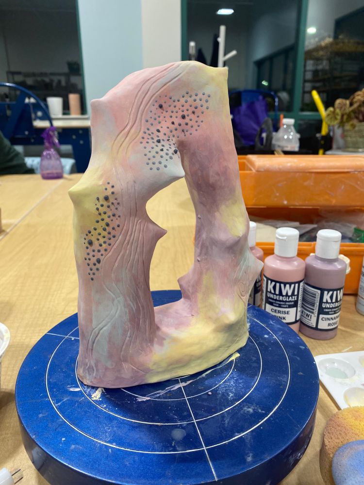 A colorful arch made of clay