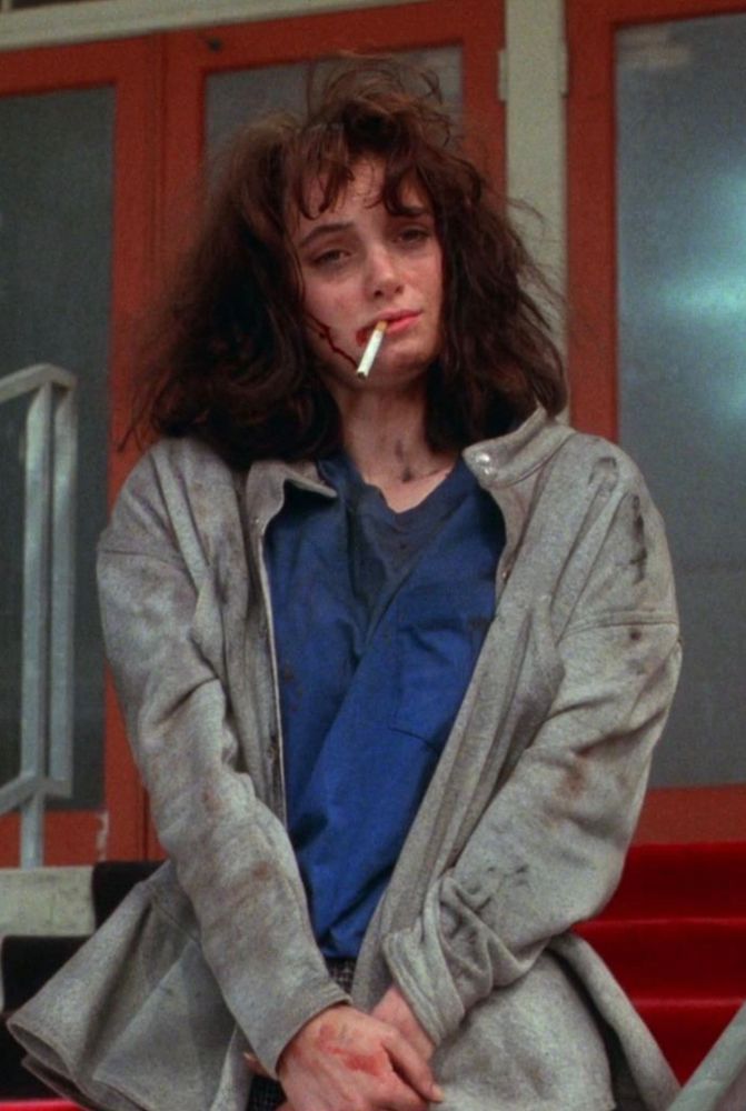 Wynona Rider at the end of Heathers, ciggy hanging out of her mouth, jacket and hair still smoldering from the school explosion.