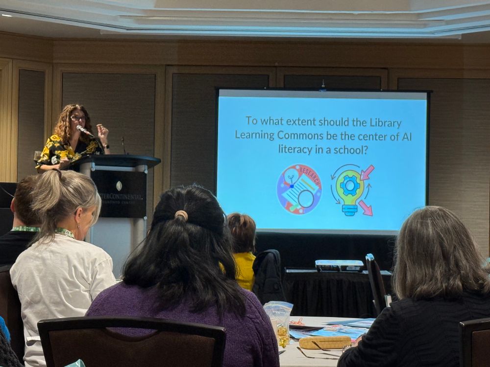 A slide that says “To what extent should the Library Learning Commons be the center of AI Literacy in a school?”
