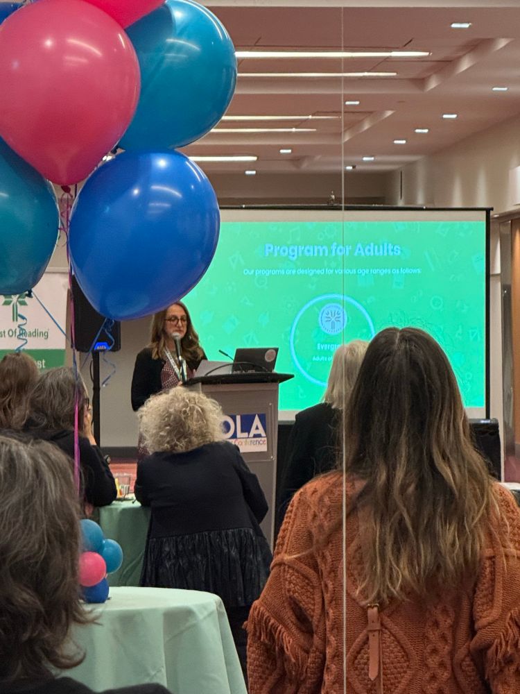 Maria Martella from Tinlids speaking at a podium