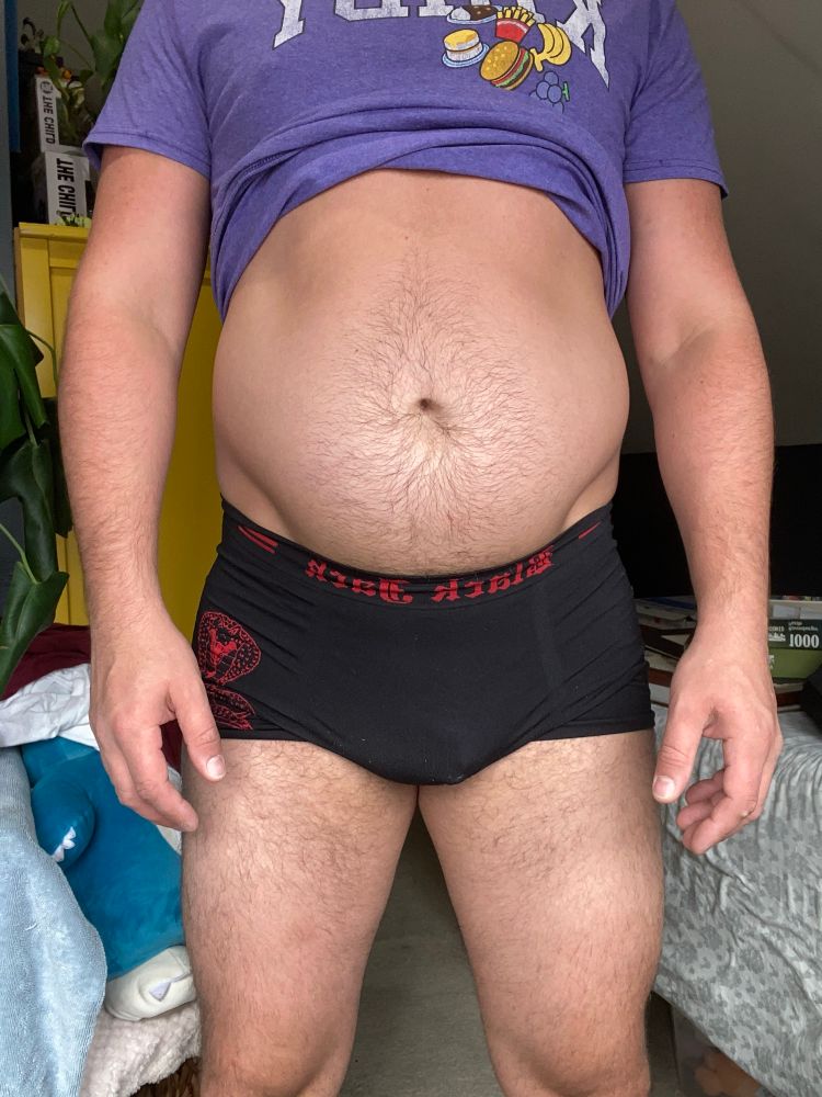 Torso shot of Joey with his shirt lifted in his underwear 