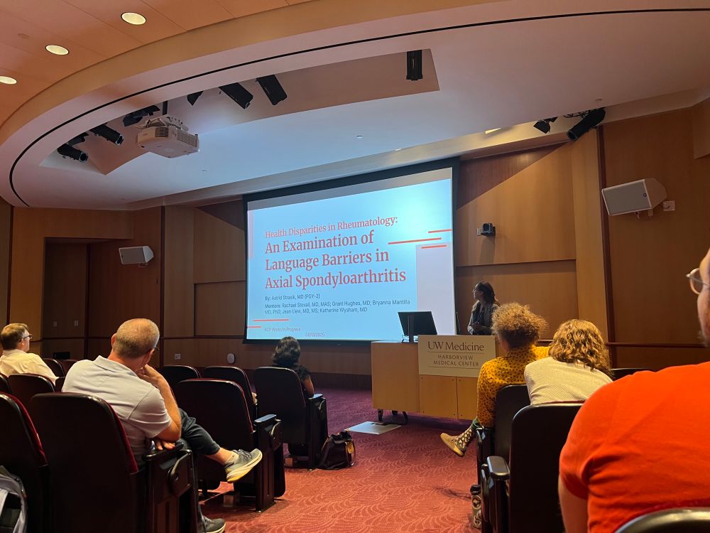 Dr Astrid Strasik presents to a small auditorium 
Slide title 
An Examination of Language Barriers in Axial Spondyloarthritis